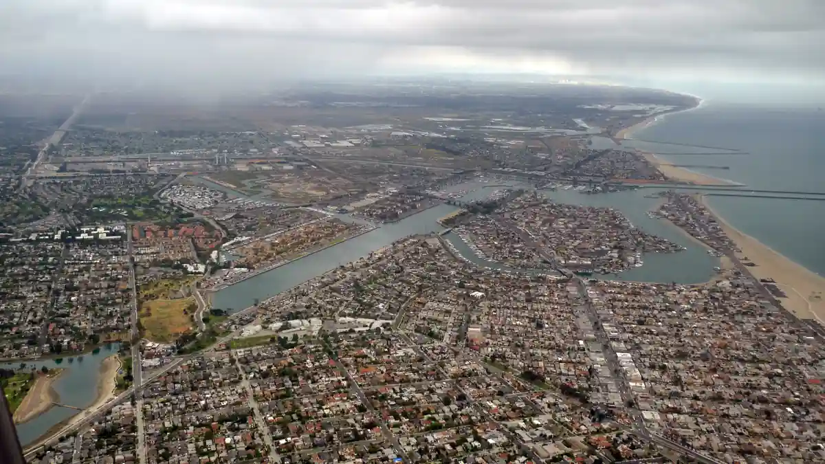 Coastal waterfront, seawall, and beachfront residences along Alamitos Bay in Long Beach, California.