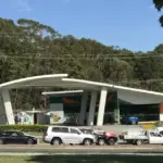 Australian service station forecourt with fuel dispensers, canopy structure and vehicle refuelling lanes