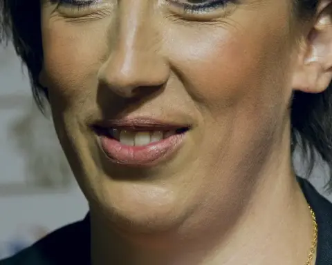 Portrait photograph of British comedian Miranda Hart smiling at a public event.