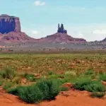 Sandstone formations and desert landscape in Monument Valley on the Navajo Nation.