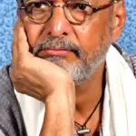 Photograph of veteran Indian actor and Naam Foundation co-founder Nana Patekar looking forward in a traditional white kurta during a public address.