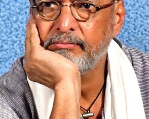 Photograph of veteran Indian actor and Naam Foundation co-founder Nana Patekar looking forward in a traditional white kurta during a public address.