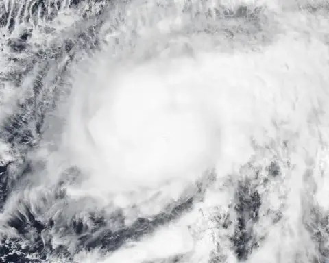 High-resolution visible satellite capture of a powerful tropical cyclone spinning over the eastern Pacific Ocean off Mexico.