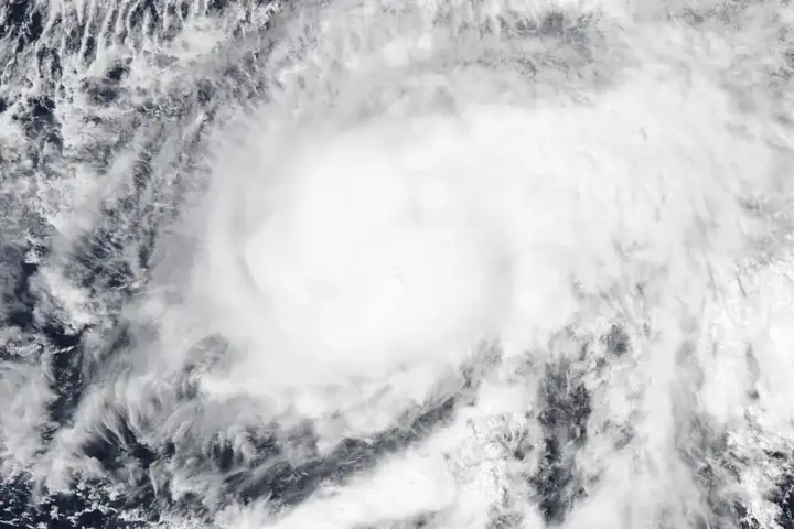 High-resolution visible satellite capture of a powerful tropical cyclone spinning over the eastern Pacific Ocean off Mexico.