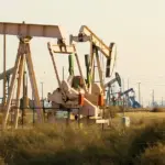 An oil pump jack operating at an oil field in California.