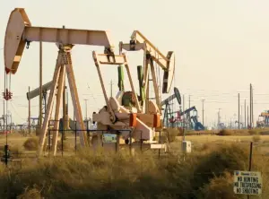 An oil pump jack operating at an oil field in California.