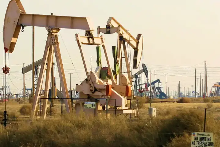 An oil pump jack operating at an oil field in California.