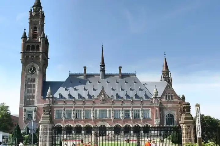 Exterior view of the historic Peace Palace courthouse building in The Hague, Netherlands.