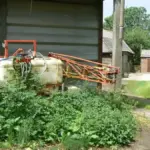 A crop sprayer in an agricultural field