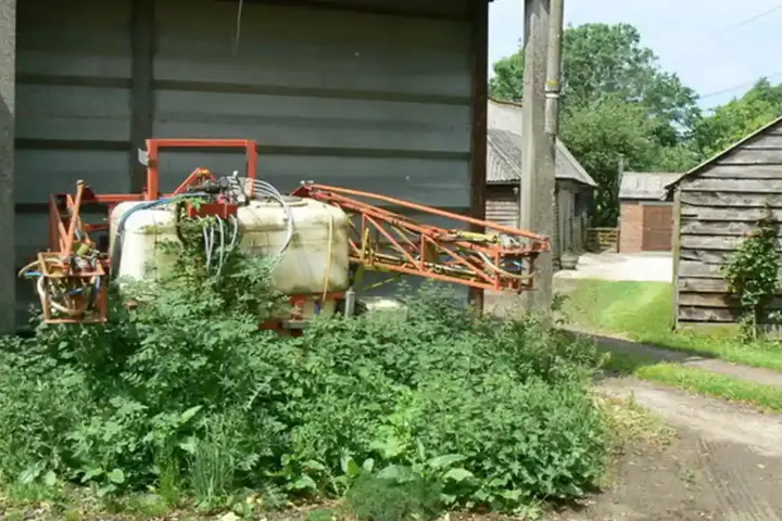 A crop sprayer in an agricultural field