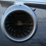 A Rolls-Royce Trent series jet engine in a hangar or on display