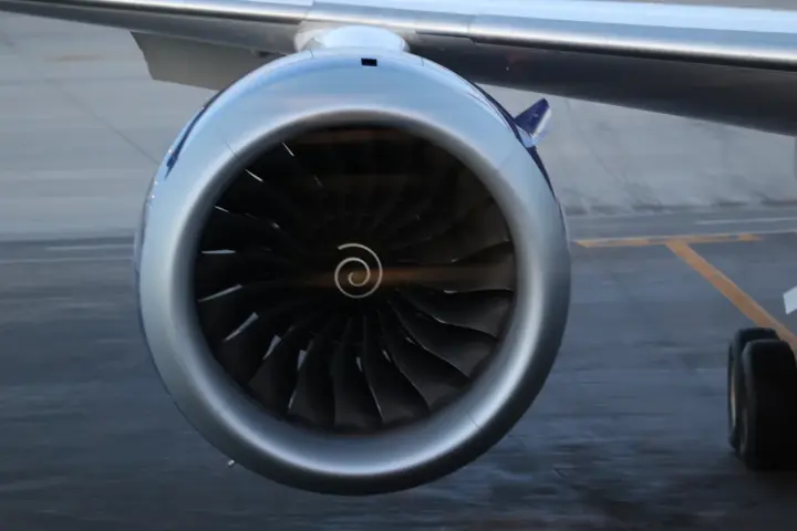 A Rolls-Royce Trent series jet engine in a hangar or on display