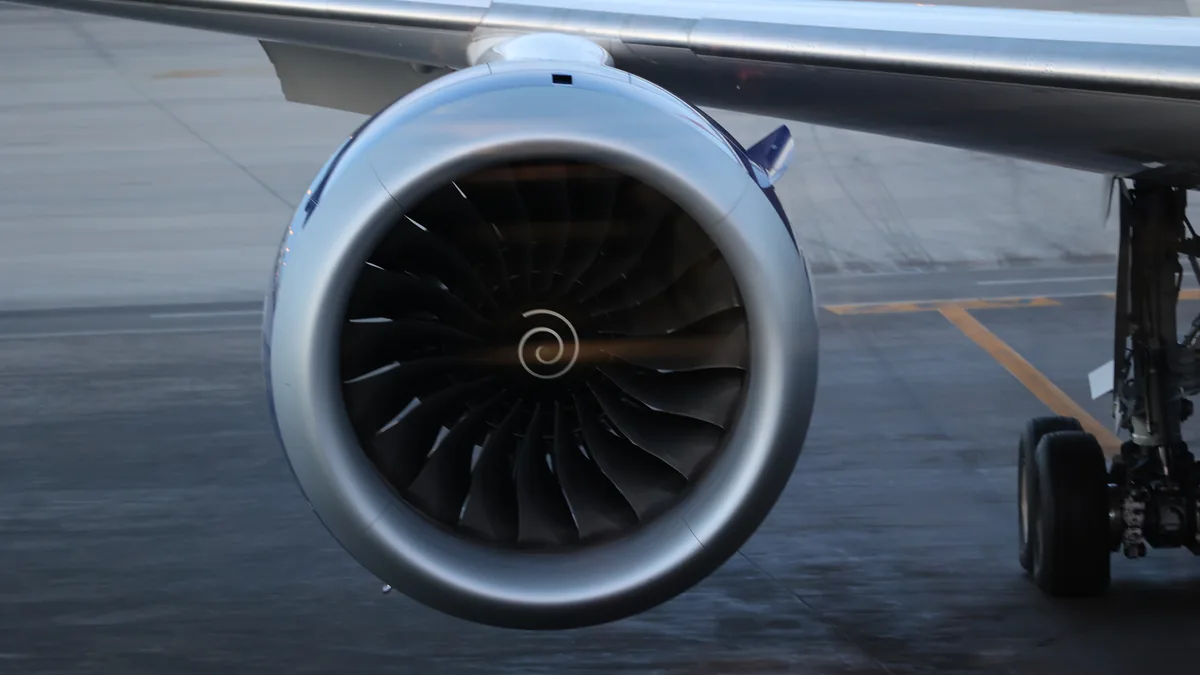 A Rolls-Royce Trent series jet engine in a hangar or on display