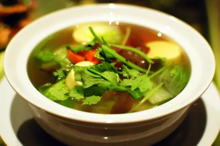 A bowl of traditional Korean miyeok-guk seaweed soup with tender beef and vegetables in savory broth