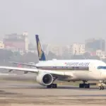 Singapore Airlines Airbus A350 passenger jet taxiing on an airport runway in clear weather
