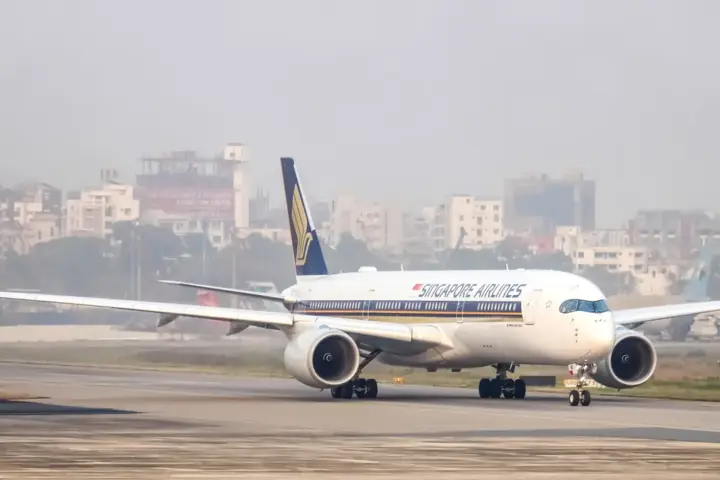 Singapore Airlines Airbus A350 passenger jet taxiing on an airport runway in clear weather
