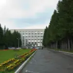 Exterior of a research building among pine trees in Siberia