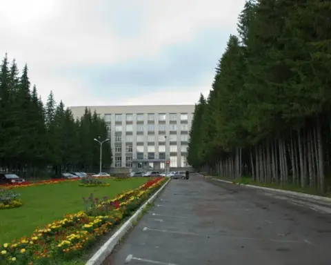 Exterior of a research building among pine trees in Siberia