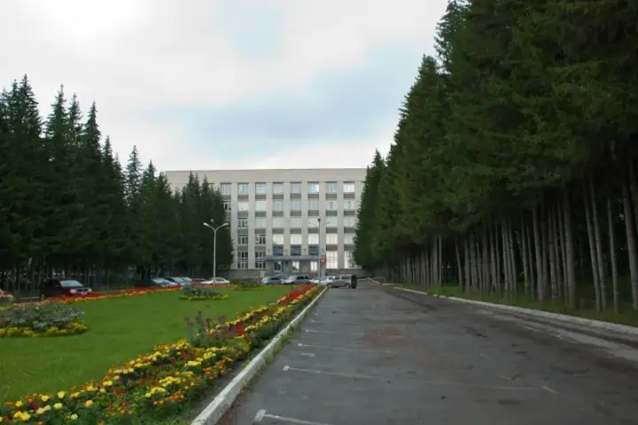 Exterior of a research building among pine trees in Siberia