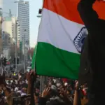 Indian university students holding placards during a protest on a college campus