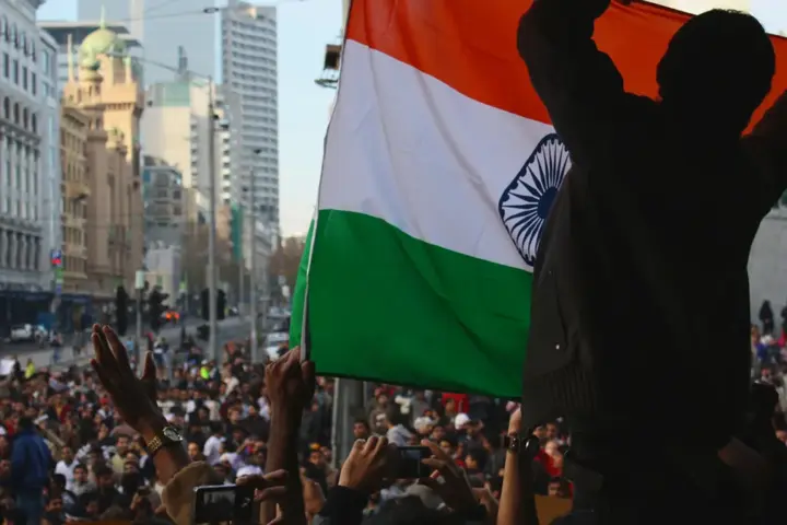 Indian university students holding placards during a protest on a college campus