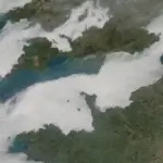 Low cloud cover stretches across the English Channel in a satellite-style atmospheric view.