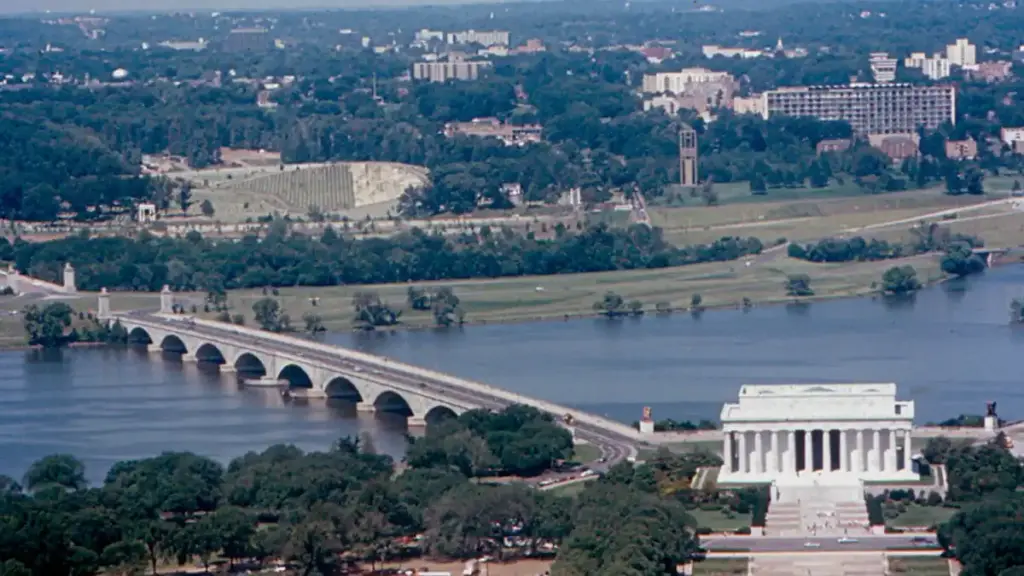 Historical documentary photograph showing the eastern span of the Arlington Memorial Bridge over the Potomac River connecting Washington D.C. to Virginia.