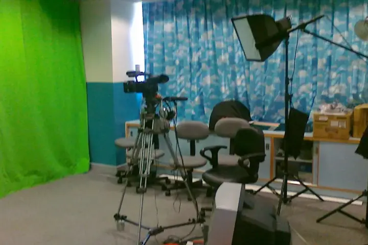 A professional television studio camera is positioned for a live broadcast.