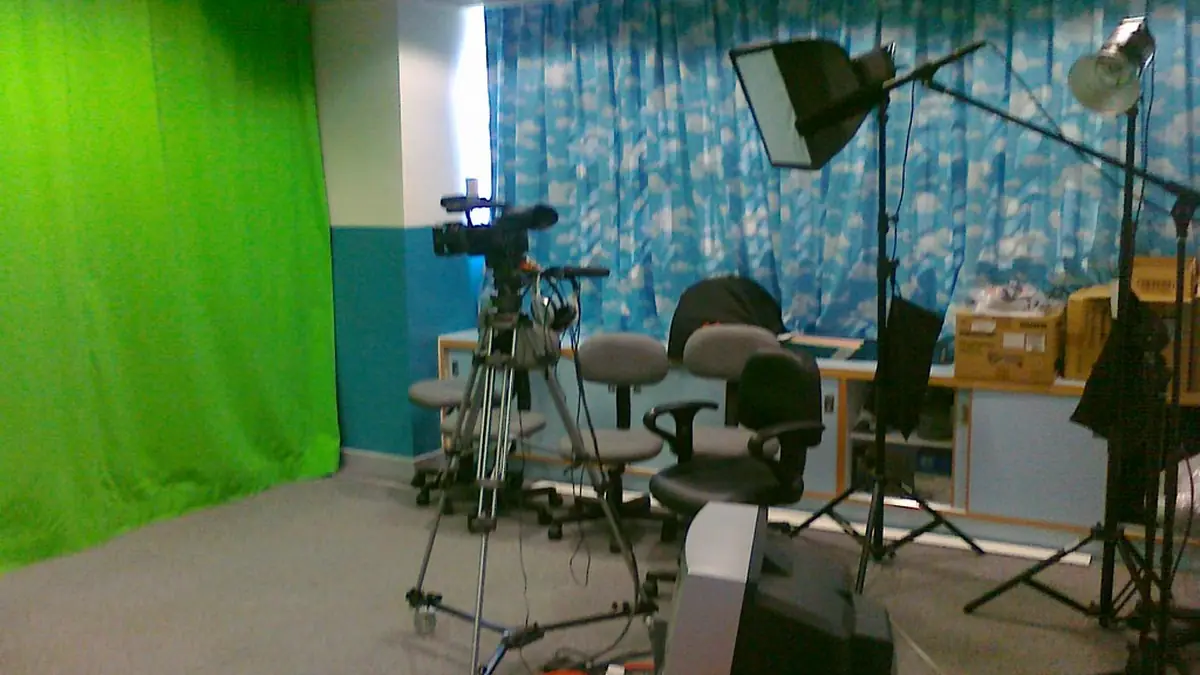 A professional television studio camera is positioned for a live broadcast.