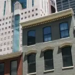 Exterior street perspective of the Michael Graves-designed Humana Building corporate headquarters in downtown Louisville, Kentucky.