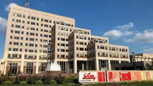 Exterior view of the Eli Lilly corporate center campus in Indianapolis, Indiana, with its entrance and landscaped grounds.