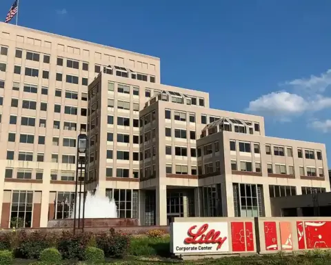 Exterior view of the Eli Lilly corporate center campus in Indianapolis, Indiana, with its entrance and landscaped grounds.