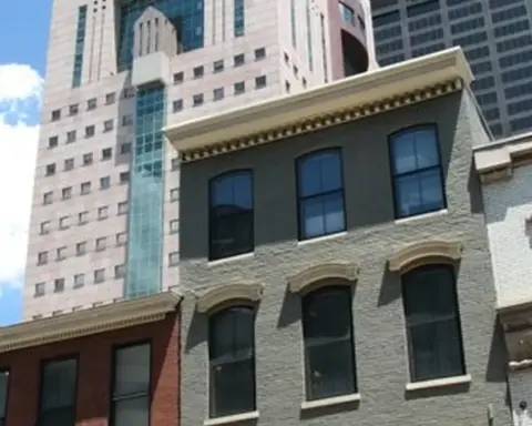 Exterior street perspective of the Michael Graves-designed Humana Building corporate headquarters in downtown Louisville, Kentucky.