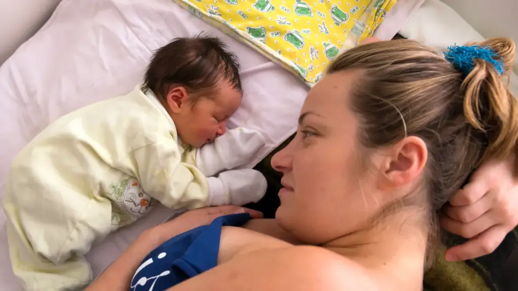 Human photograph of a mother holding a newborn infant.