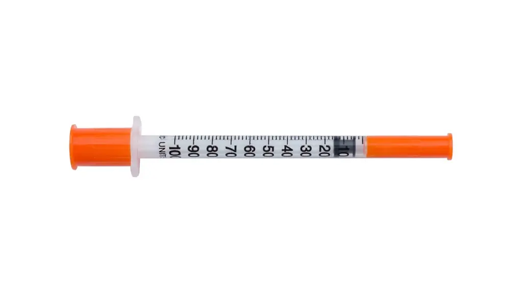 A medical syringe photographed against a plain background.