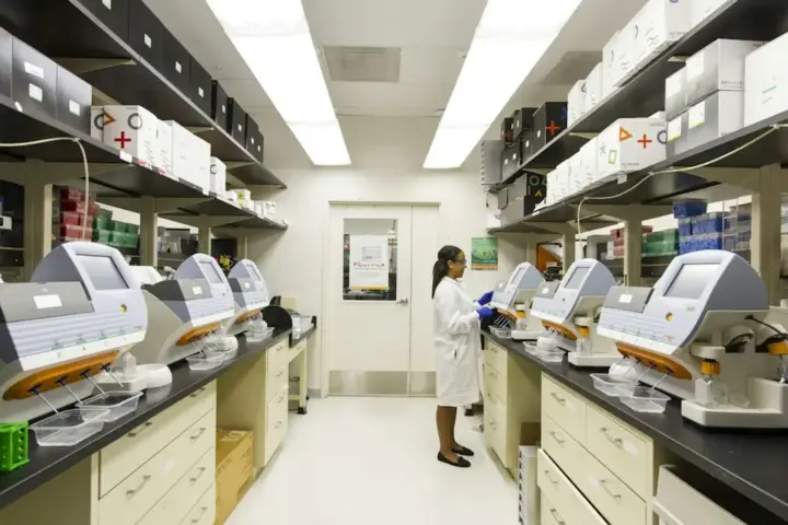 Laboratory technician preparing oncology samples in a clinical trial facility evaluating androgen receptor inhibitors