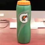 Rows of 28-ounce Gatorade sports drink bottles arranged on a retail store shelf.