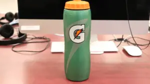 Rows of 28-ounce Gatorade sports drink bottles arranged on a retail store shelf.