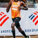 Runner competing in the 2025 Chicago Marathon on a Chicago street.