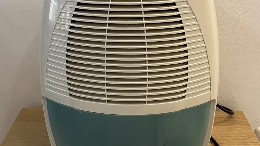 A household air dehumidifier unit with a European plug, illustrating the condensation technology atmospheric water generators rely on