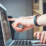 Person using a smartphone with a messaging interface out of focus