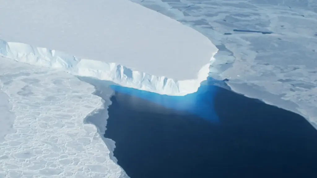 Blue ice calving front of Thwaites Glacier meeting the Southern Ocean, photographed from a NASA research aircraft