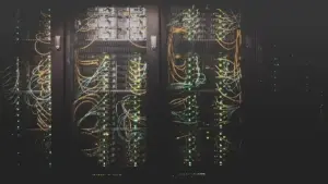 Rows of illuminated server racks in a data center