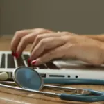Healthcare professional consulting with an adult patient during a clinical neurology evaluation