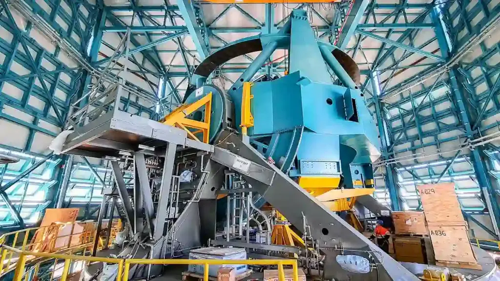 Wide view of the Simonyi Survey Telescope mount assembly inside the Vera C. Rubin Observatory dome in Chile.