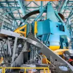 Wide view of the Simonyi Survey Telescope mount assembly inside the Vera C. Rubin Observatory dome in Chile.
