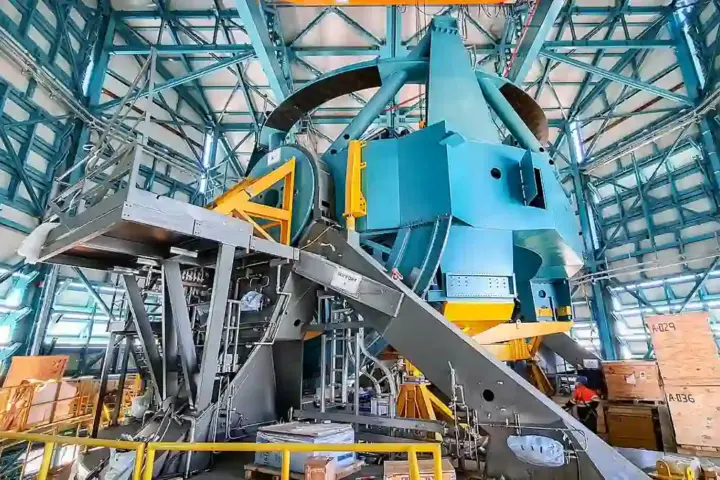Wide view of the Simonyi Survey Telescope mount assembly inside the Vera C. Rubin Observatory dome in Chile.