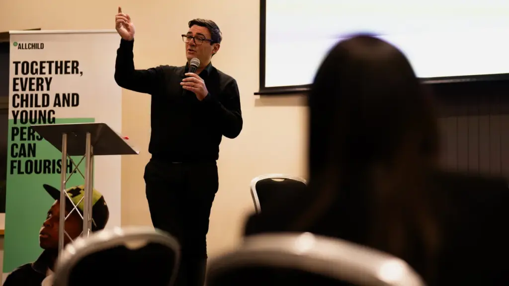 Andy Burnham speaking at a public event in 2024