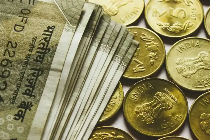 Assorted banknotes arranged near a currency exchange workspace