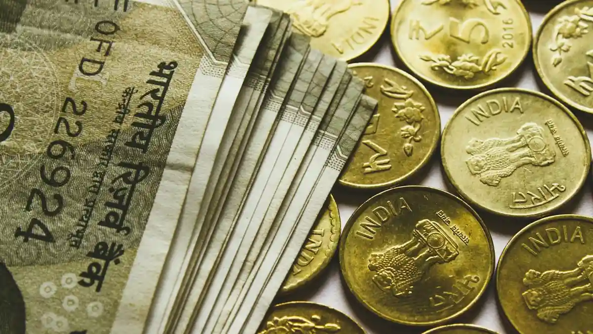 Assorted banknotes arranged near a currency exchange workspace